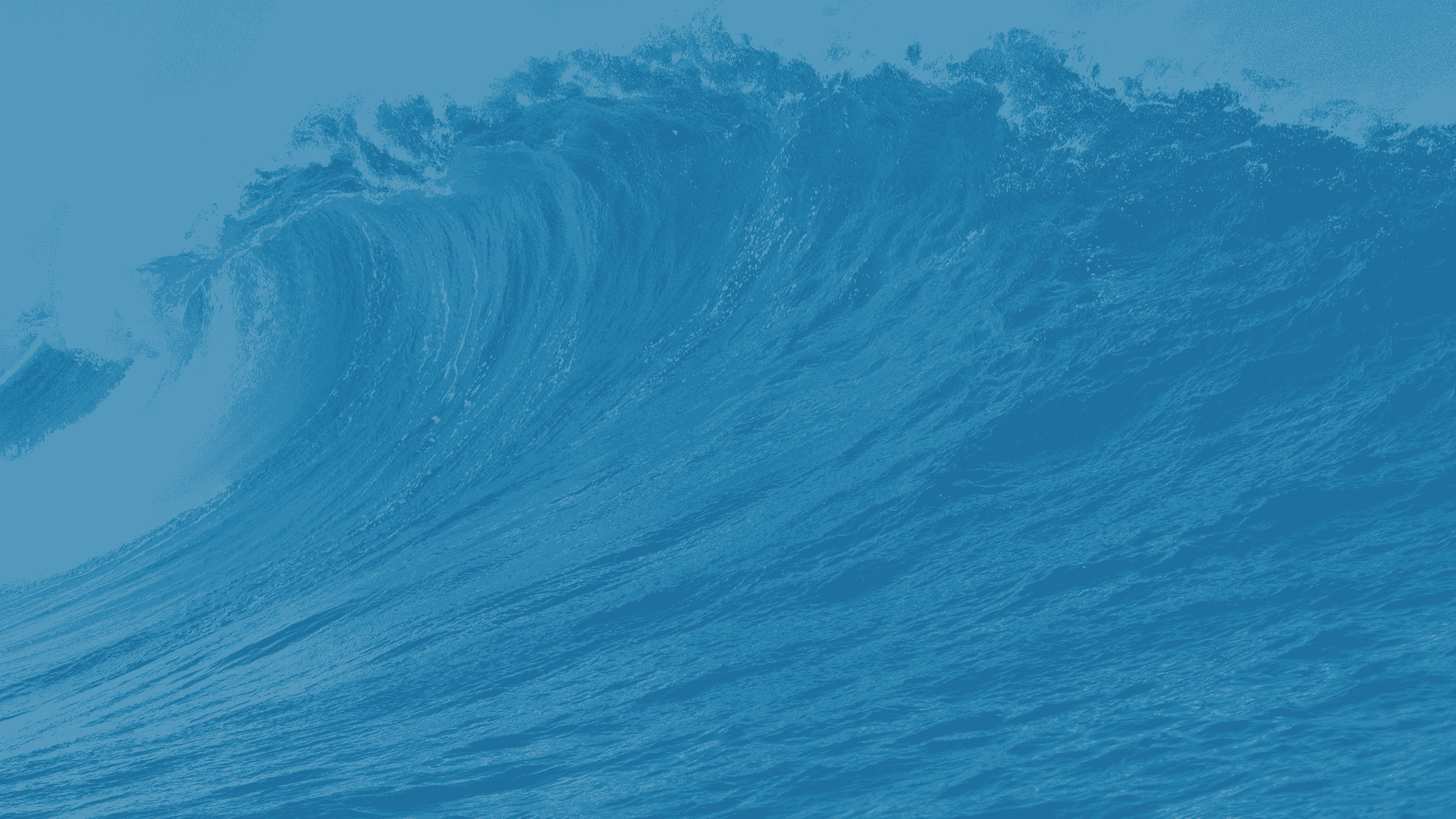 A large ocean wave curling and crashing.