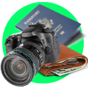 A camera, passport, and wallet on a green background.
