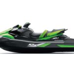 A sleek black and green personal watercraft with aerodynamic design.