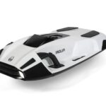 A sleek white and black underwater scooter designed for diving.