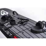 Black wakeboard with bindings on a white background.