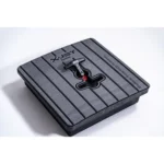 Black plastic base plate with mounting holes and a central locking mechanism.