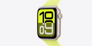 Close-up of a smartwatch with a lime green band and large digital numbers on screen.