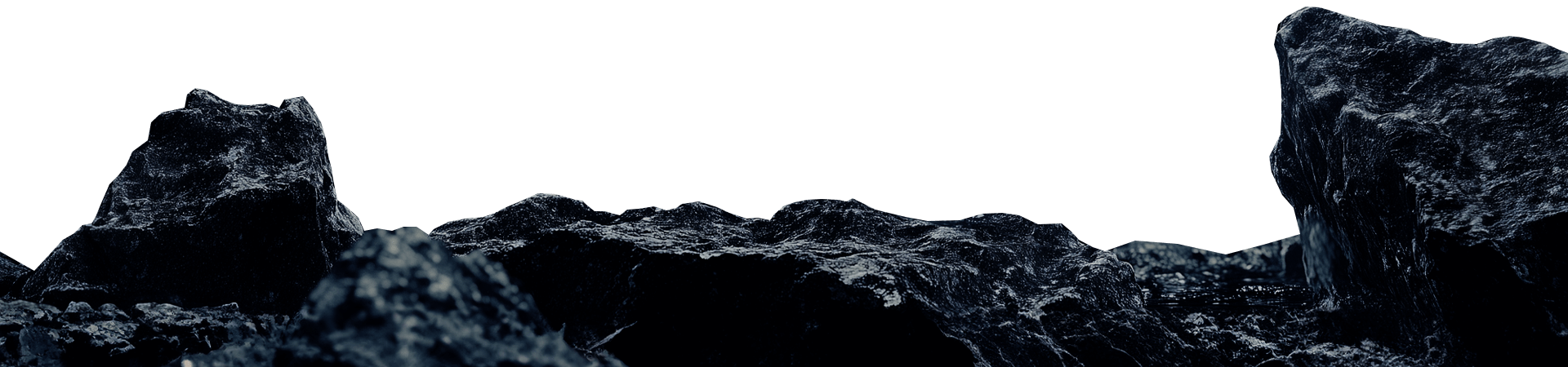 Dark rocky terrain under a deep gray sky.